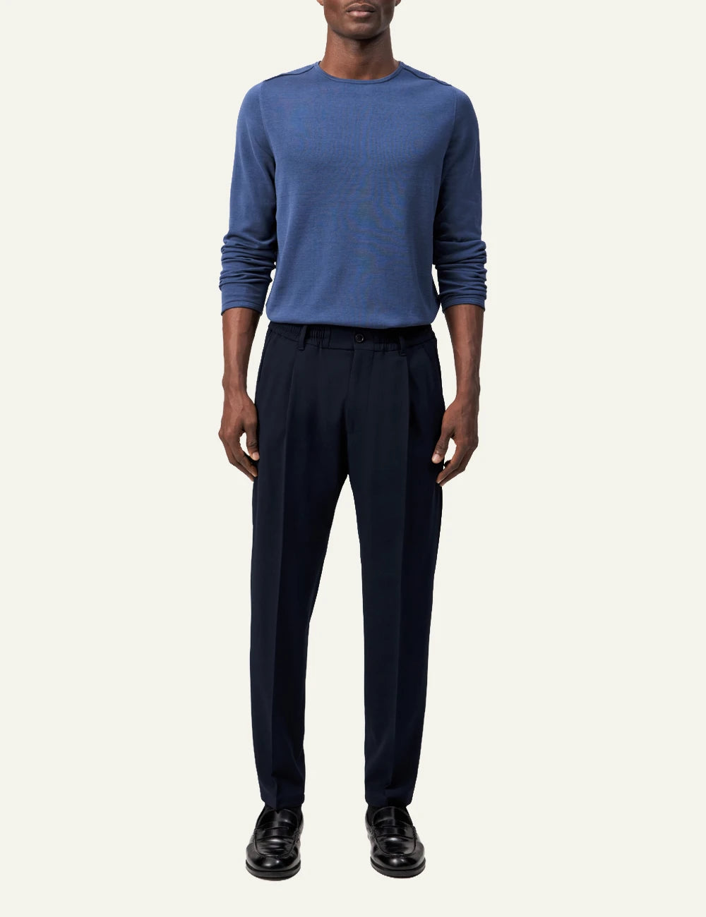 Men's DRYKORN dark navy tailored pants with tapered leg and cropped fit full body