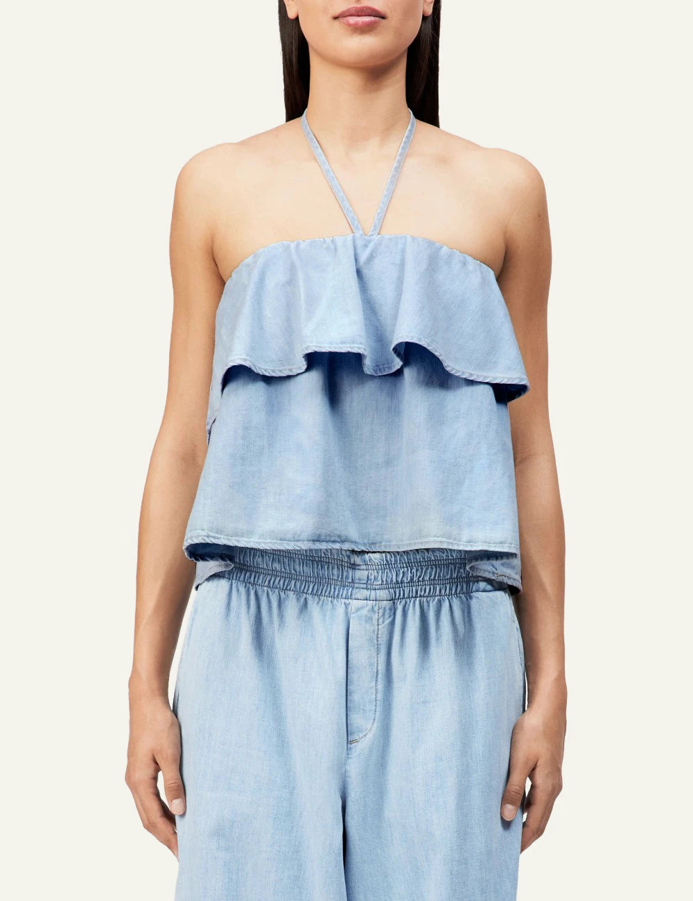 Drykorn RIVANA bandeau top light blue denim look cropped sleeveless ruffle front model view