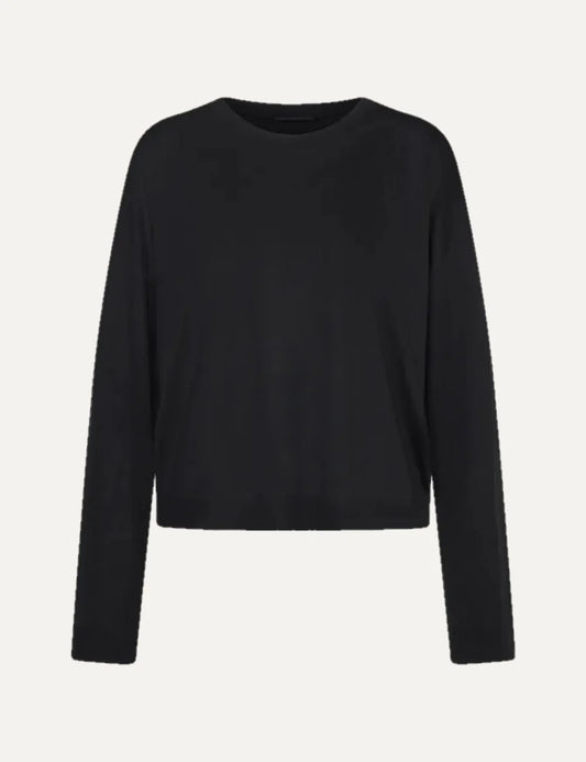 Drykorn women's black relaxed-fit long sleeve top with a round neckline, dropped shoulders and a loose silhouette.