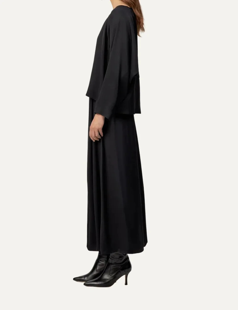 Drykorn women's black satin blouse with a relaxed wide silhouette, round neckline, softly draped long sleeves and subtle sheen side