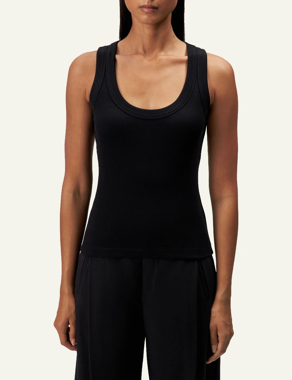 Women's DRYKORN black ribbed cotton tank top with scoop neck and slim fit model