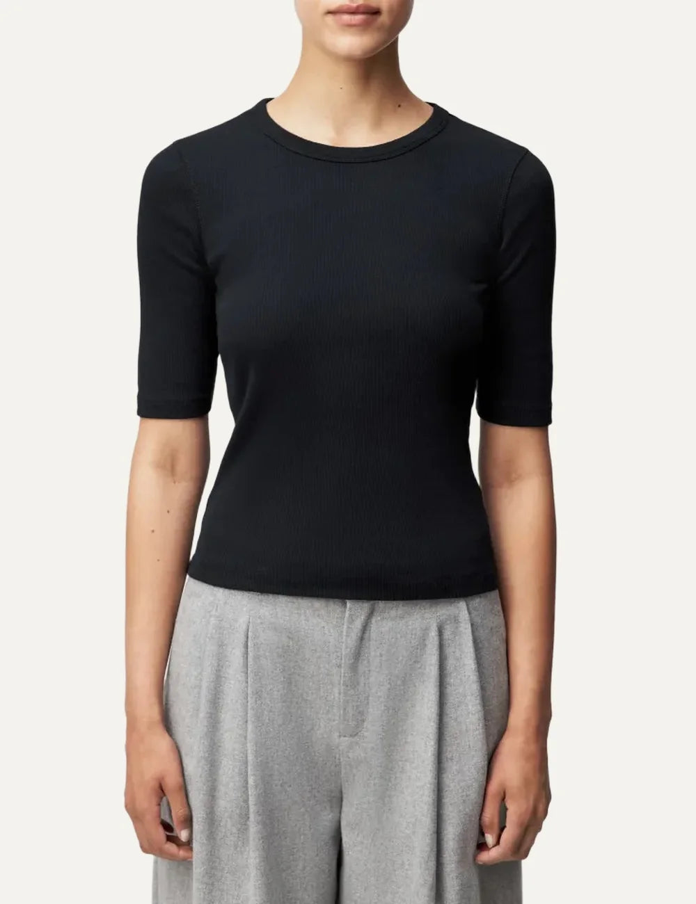 Drykorn women's black slim-fit T-shirt with a round neckline, three-quarter sleeves and fine ribbed cotton texture model