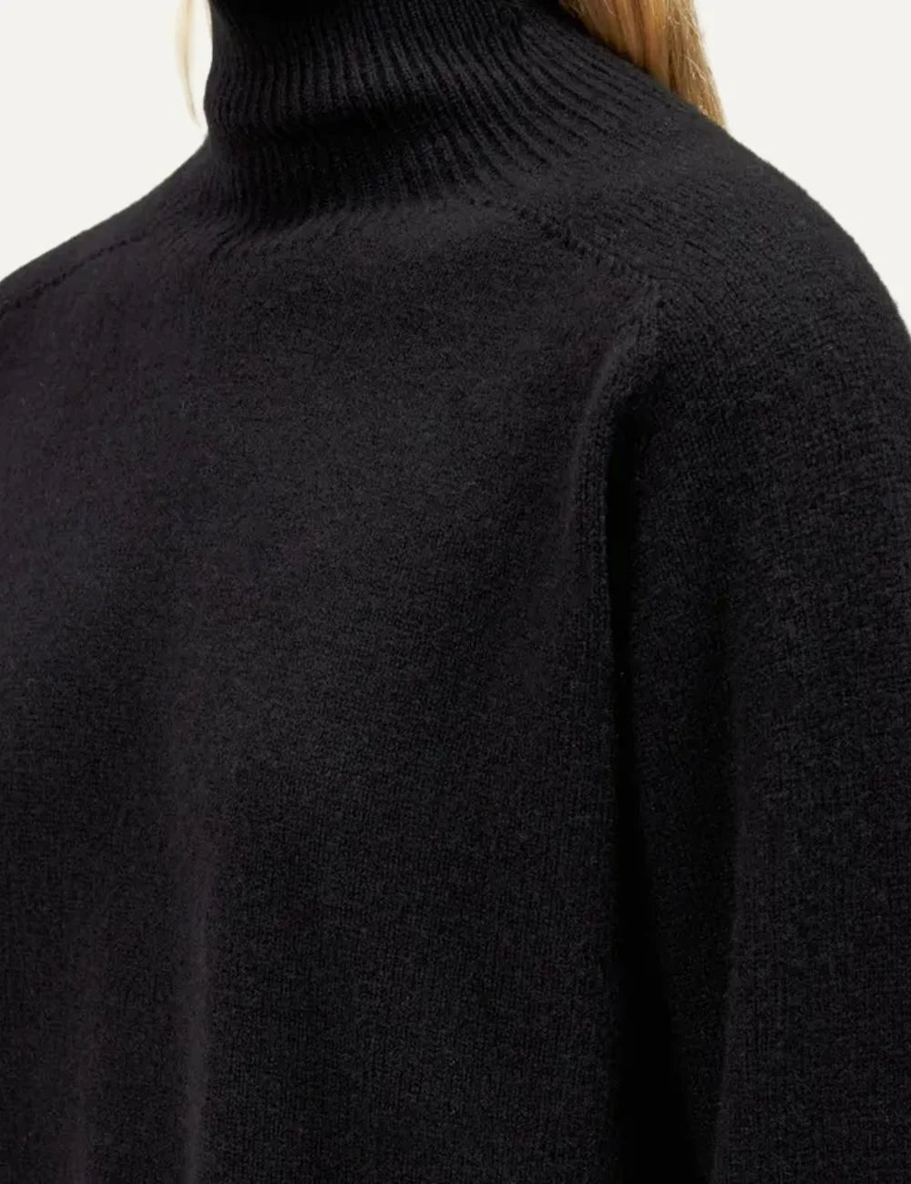 Drykorn women's black cropped wool knit sweater with a ribbed turtleneck, long sleeves, ribbed trims and side slits detail