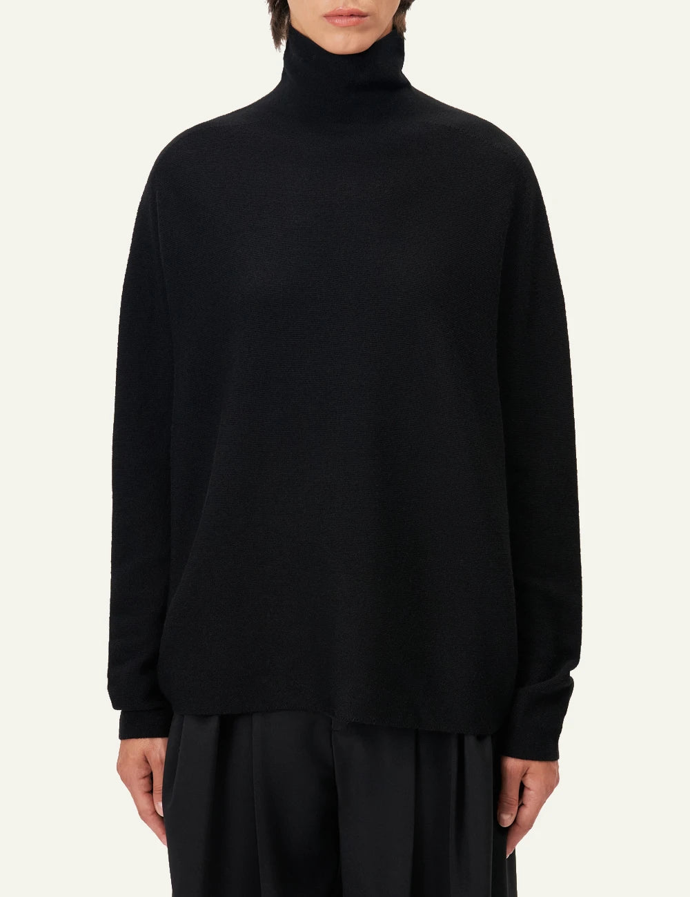 Women's DRYKORN Liora oversized merino wool turtleneck sweater in black model