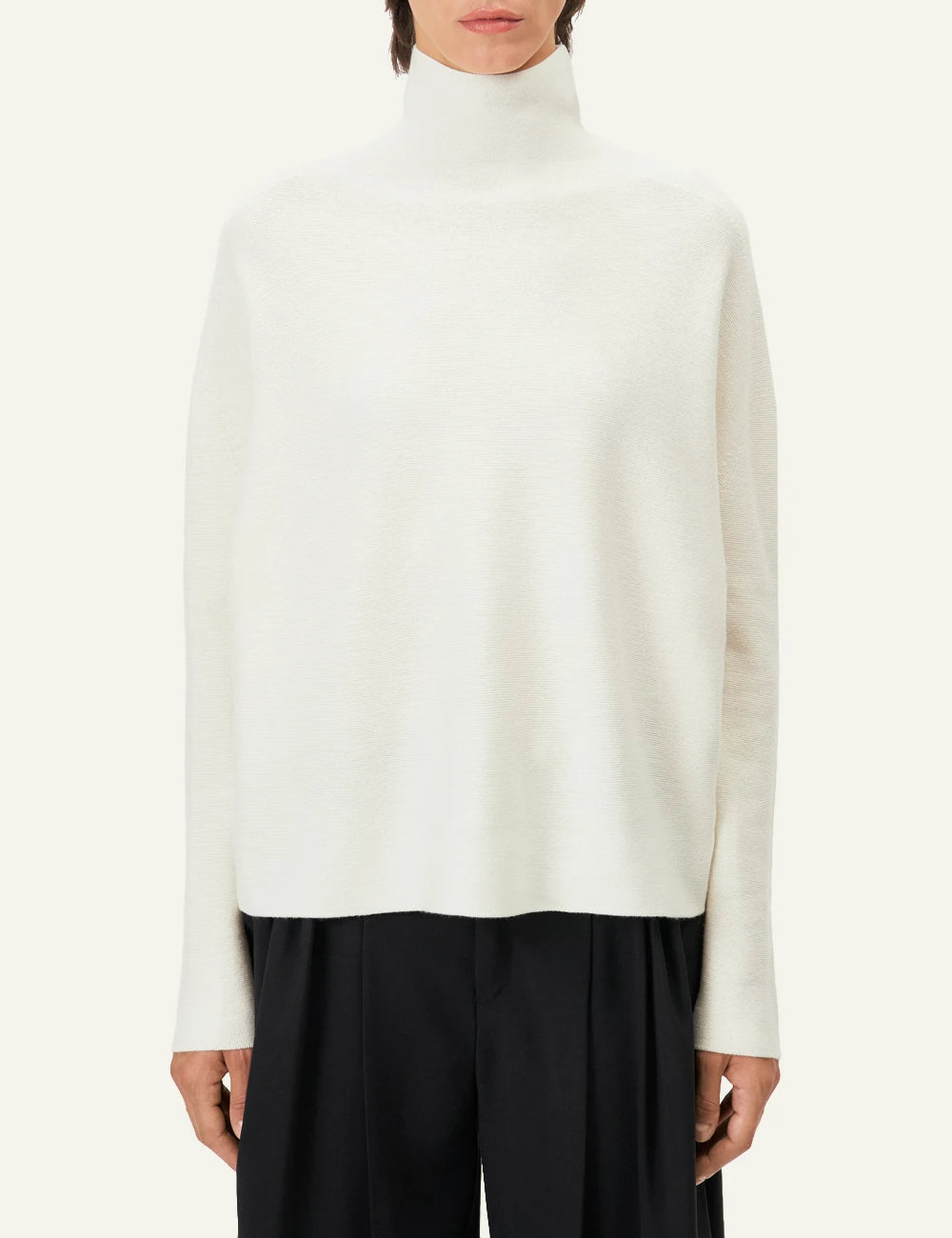 Women's DRYKORN Liora oversized merino wool turtleneck sweater in ivory model