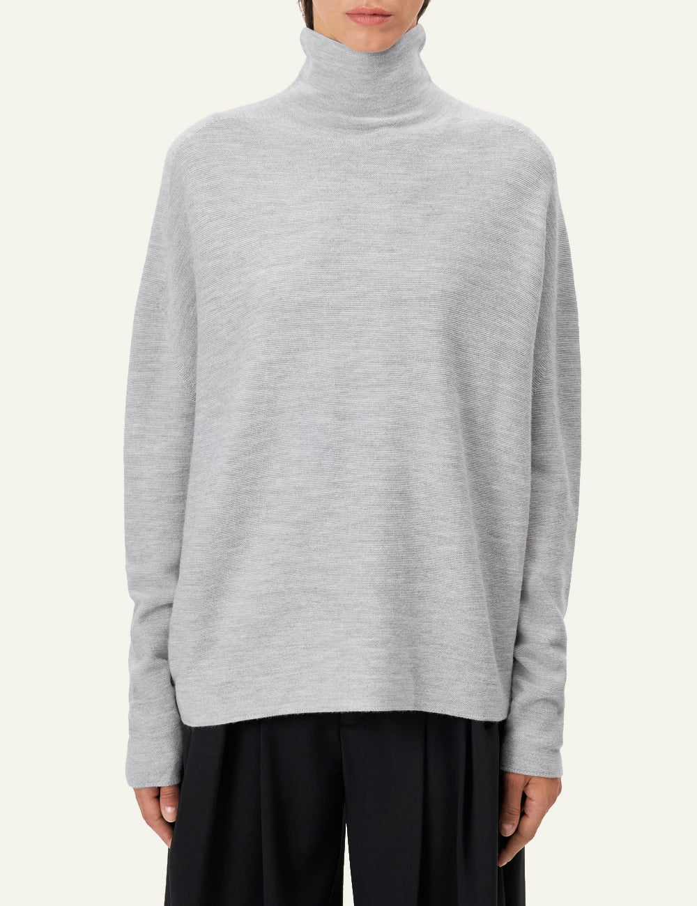 Women's DRYKORN Liora oversized merino wool turtleneck sweater in light grey model
