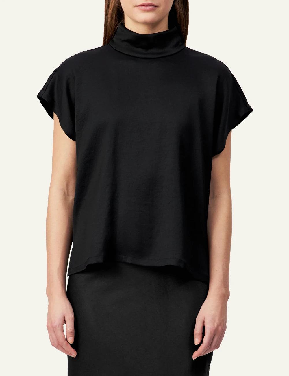 Women's DRYKORN satin blouse in black with stand collar and relaxed fit model