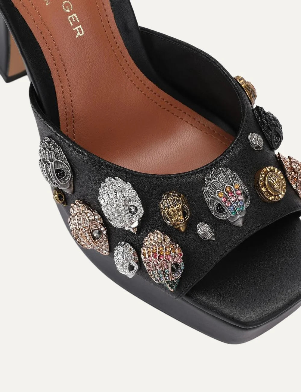 Kurt Geiger London black leather platform sandals with open toe, embellished eagle head details, ankle strap and high block heel angled