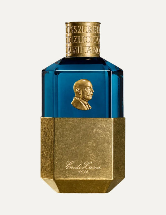 Eredi Zucca unisex Novecento perfume 100ml in a luxurious blue glass bottle with antique gold metallic detailing, embossed portrait medallion and engraved gold cap.