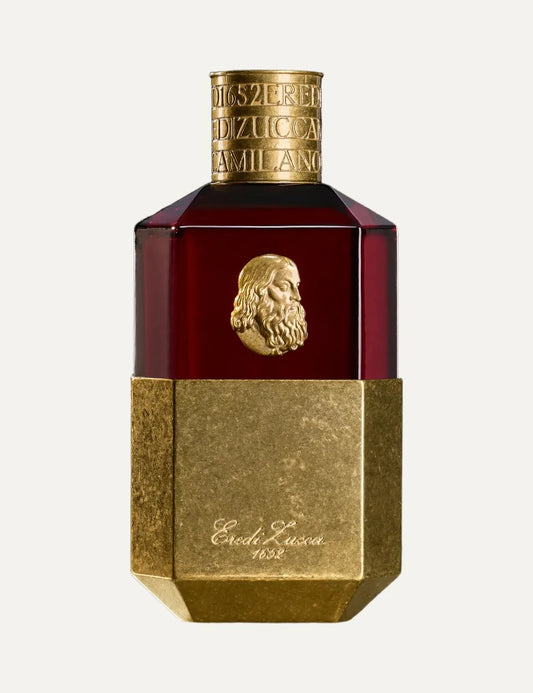 Eredi Zucca Ultima Cena unisex Eau de Parfum 100ml in a deep red glass bottle with antique gold metallic base, embossed Leonardo da Vinci portrait medallion and engraved gold cap.