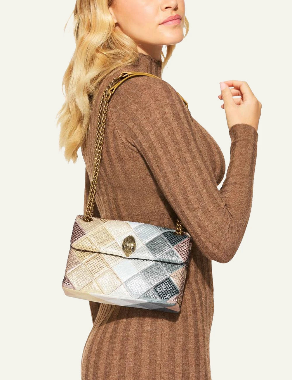 Kurt Geiger Medium Kensington sequin bag worn on shoulder on model