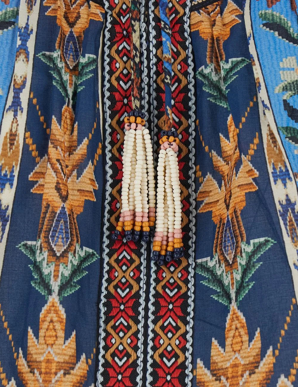 Farm Rio embroidered tapestry blouse blue puff sleeves tassels front detail view