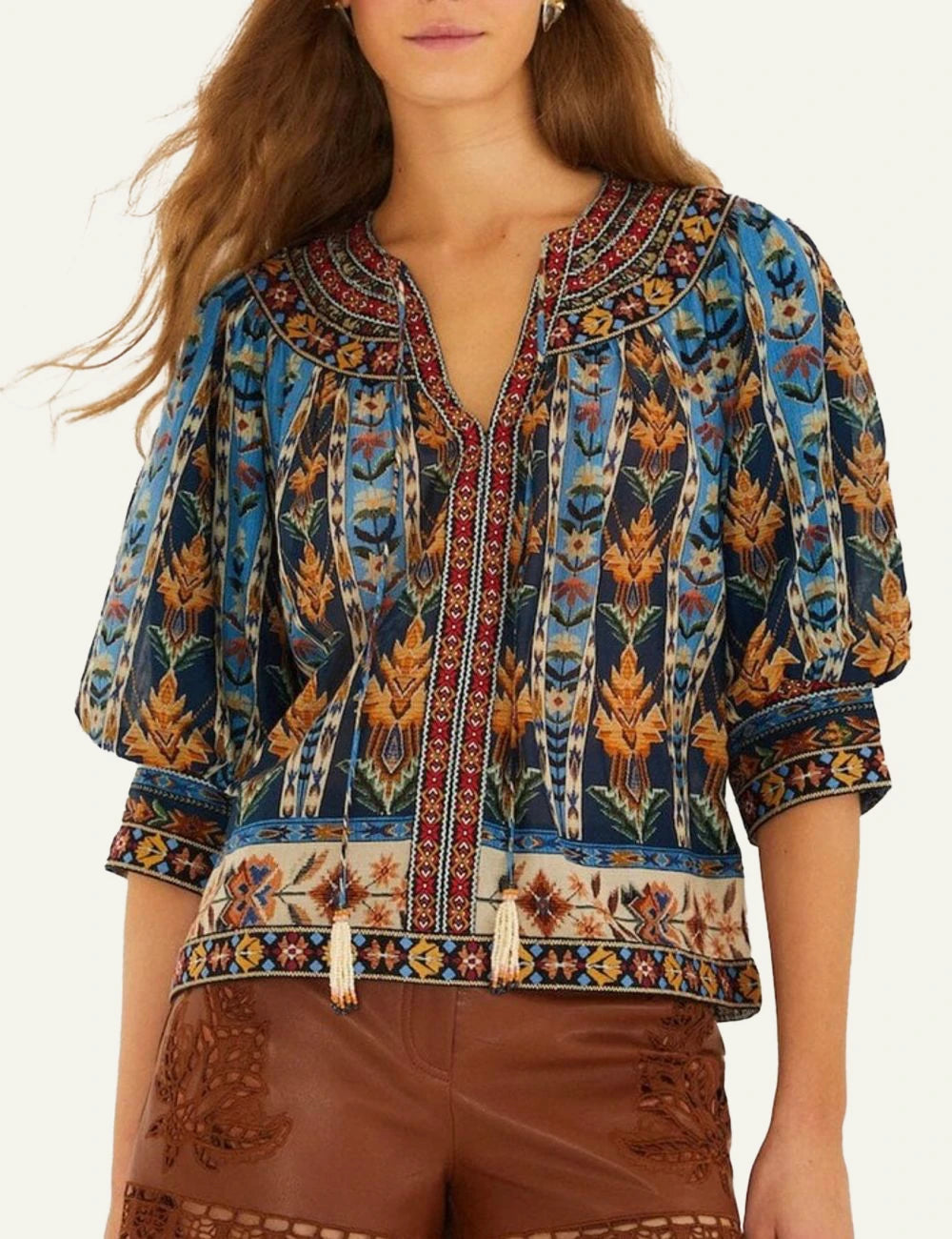Farm Rio embroidered tapestry blouse blue puff sleeves tassels front model view