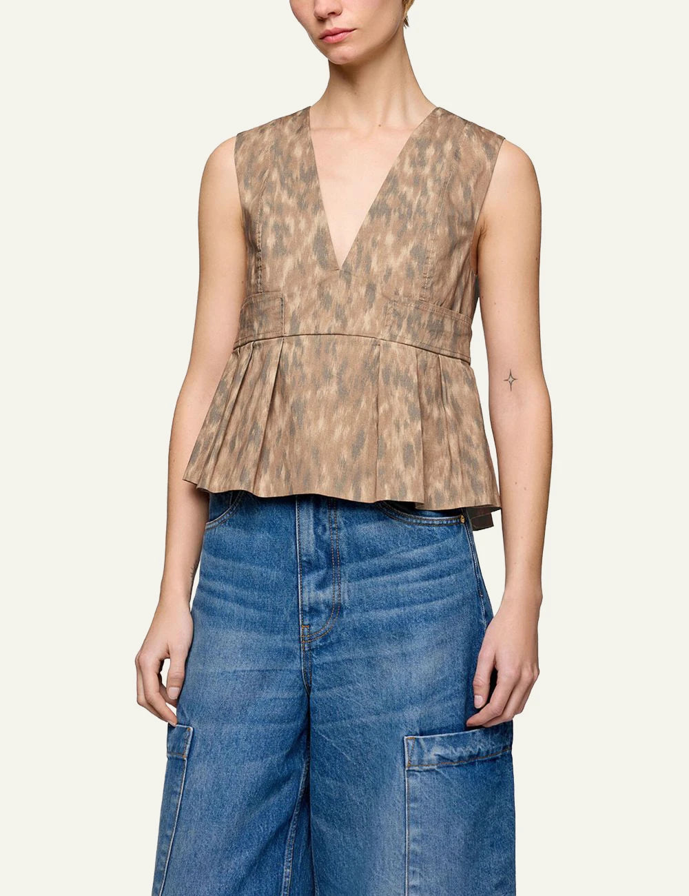 Ganni sleeveless top animal print with pleated hem front model view