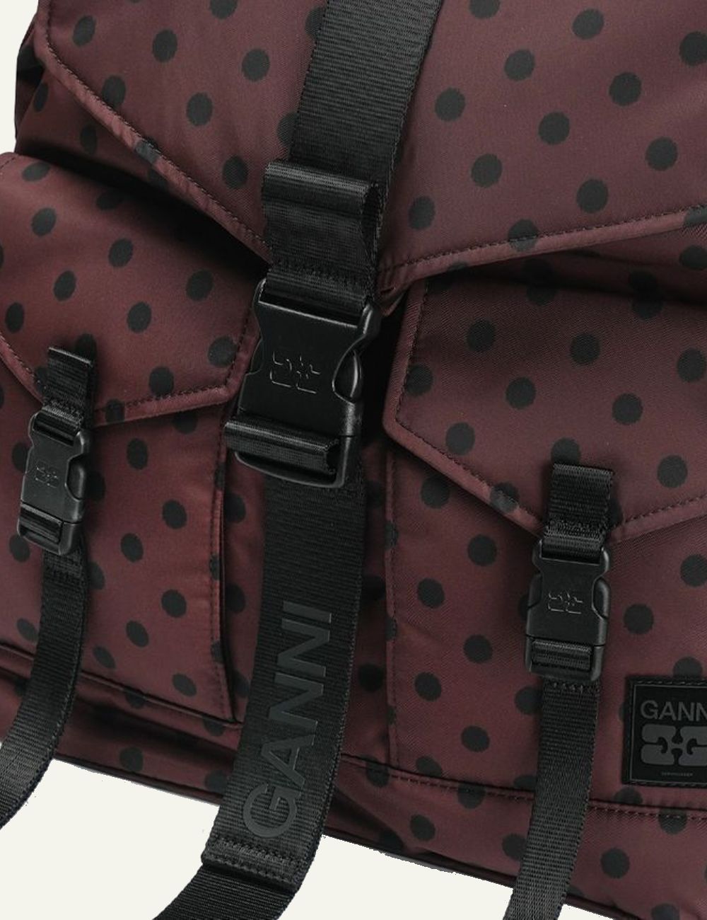 Ganni brown polka dot nylon backpack with black straps and front buckle closure detail
