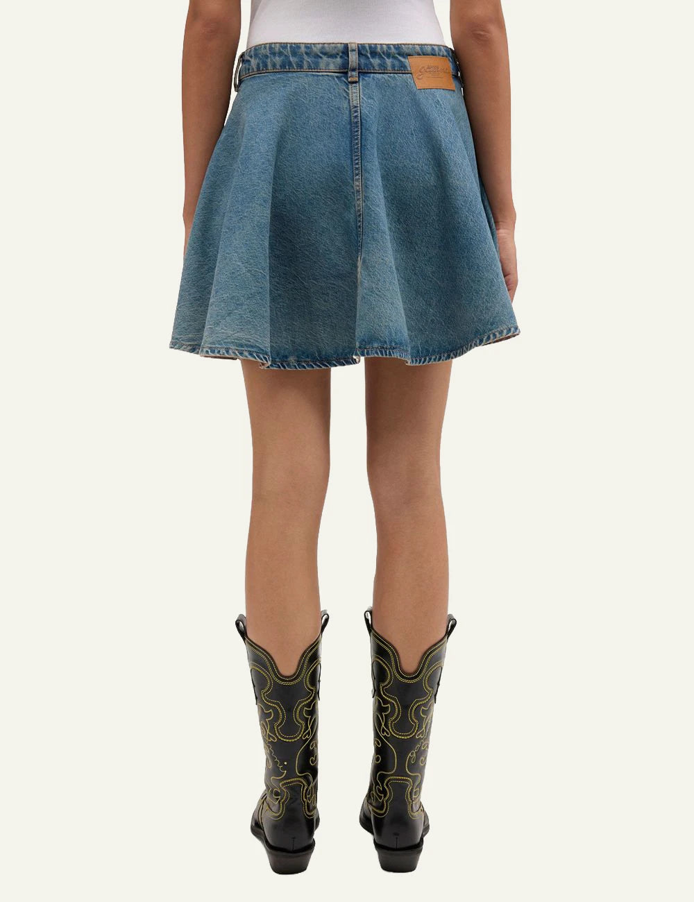 Ganni denim mini skirt blue back view on model