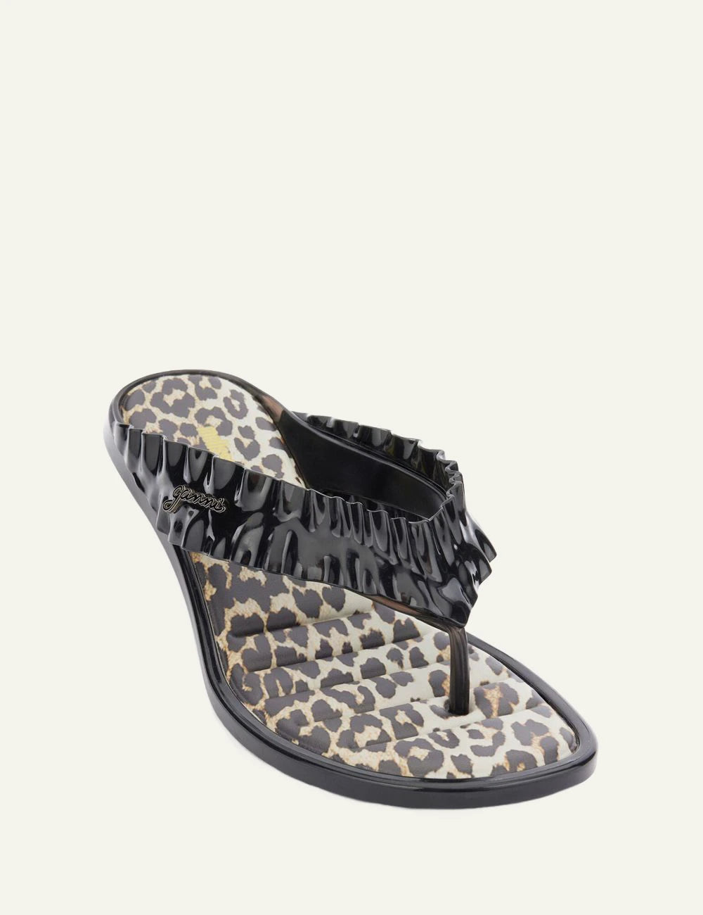 Ganni black heeled flip flop sandal with ruffle strap angled view