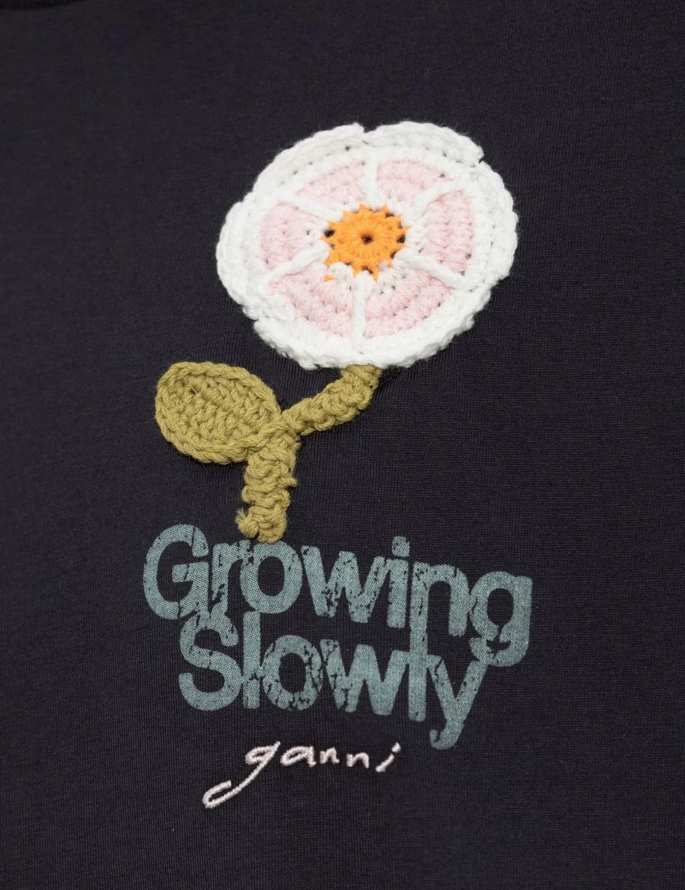 Ganni long sleeve top black crochet flower patch growing slowly front logo
