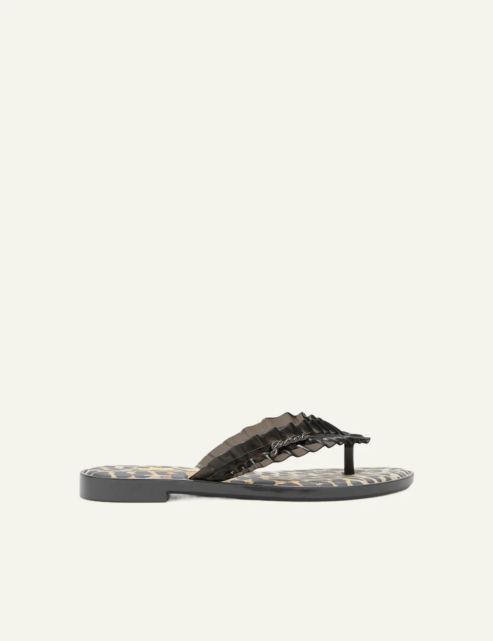 Ganni black flip flop sandal with ruffle strap and graphic footbed side view