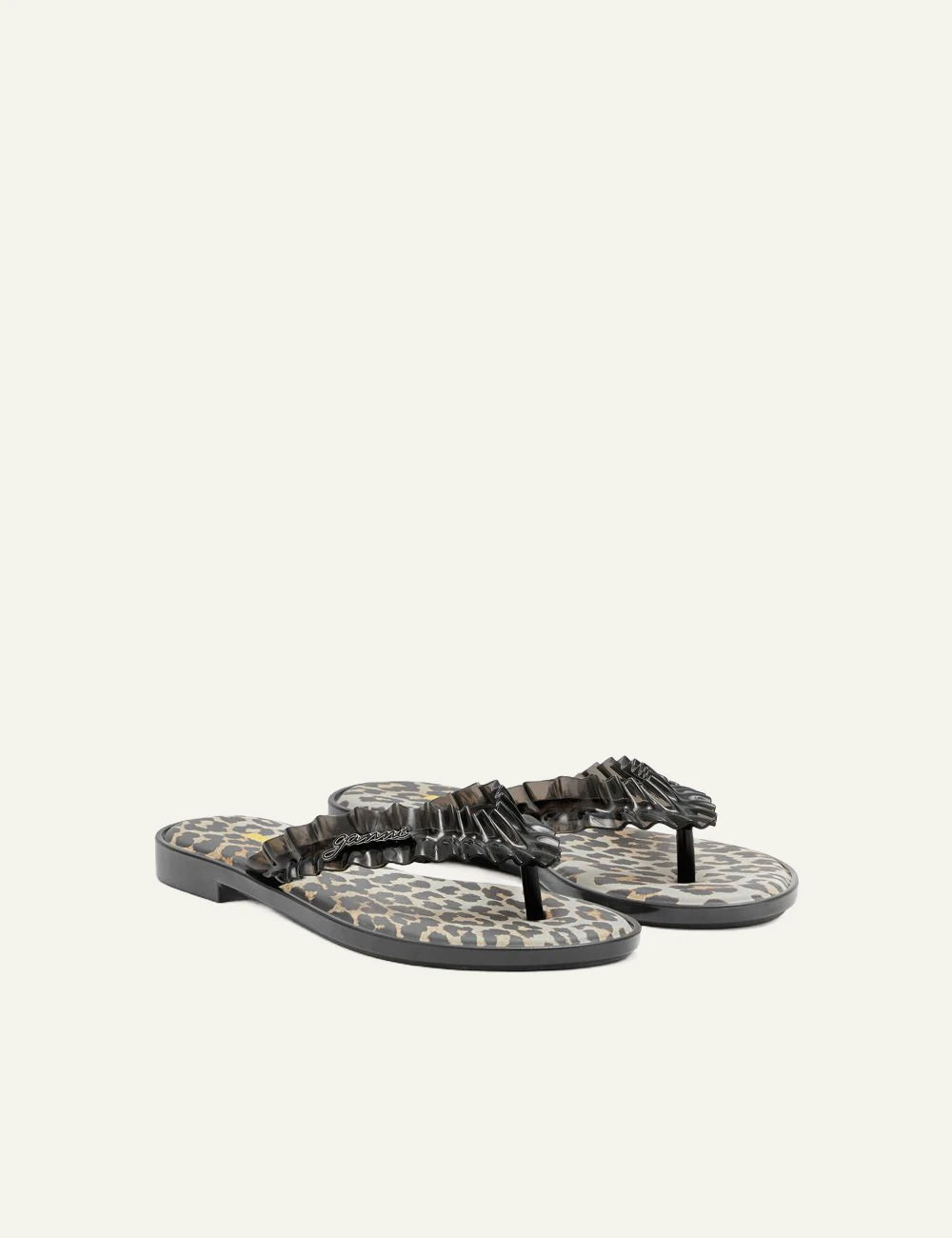 Ganni black flip flop sandal with ruffle strap and graphic footbed profile view