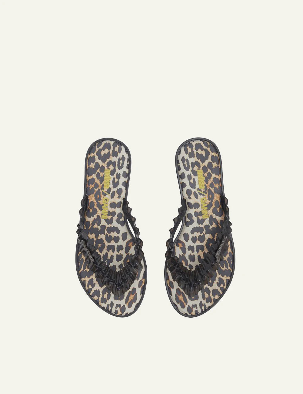 Ganni black flip flop sandal with ruffle strap and graphic footbed top view