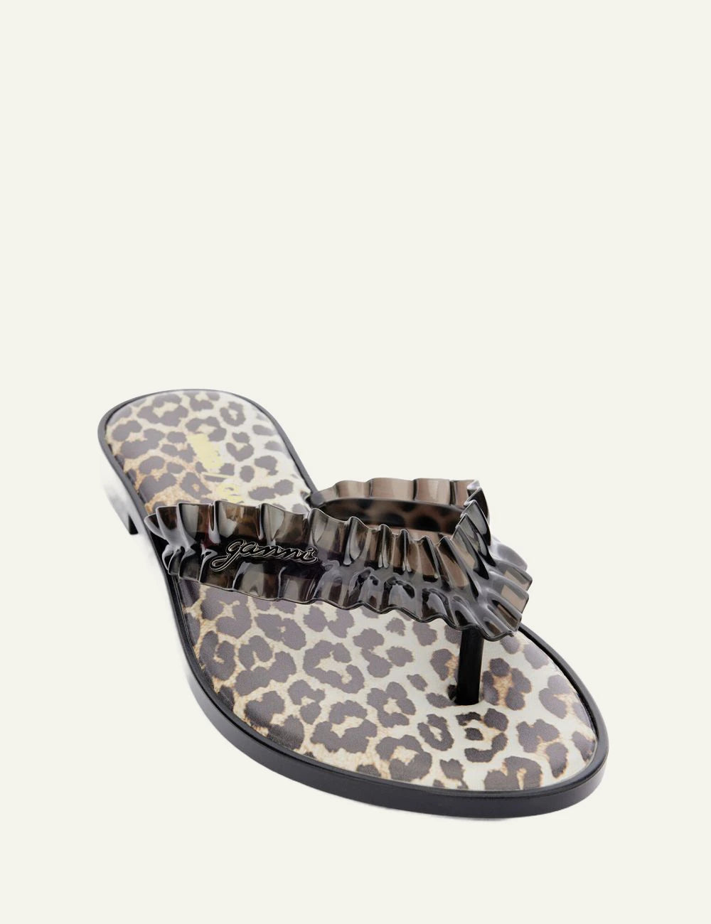 Ganni black flip flop sandal with ruffle strap and graphic footbed angled view