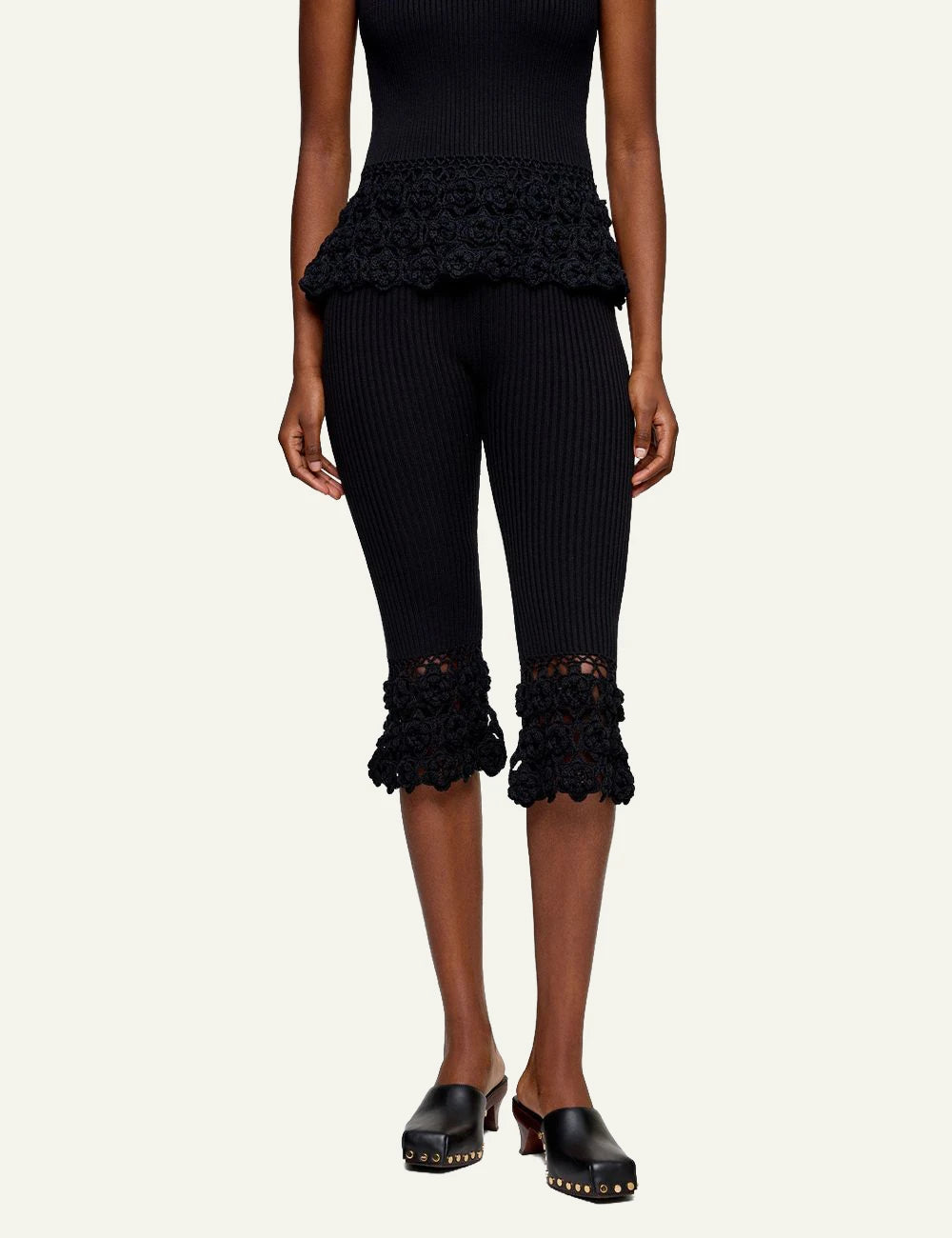 Ganni rib crochet pants black flared knit hem detail front model view