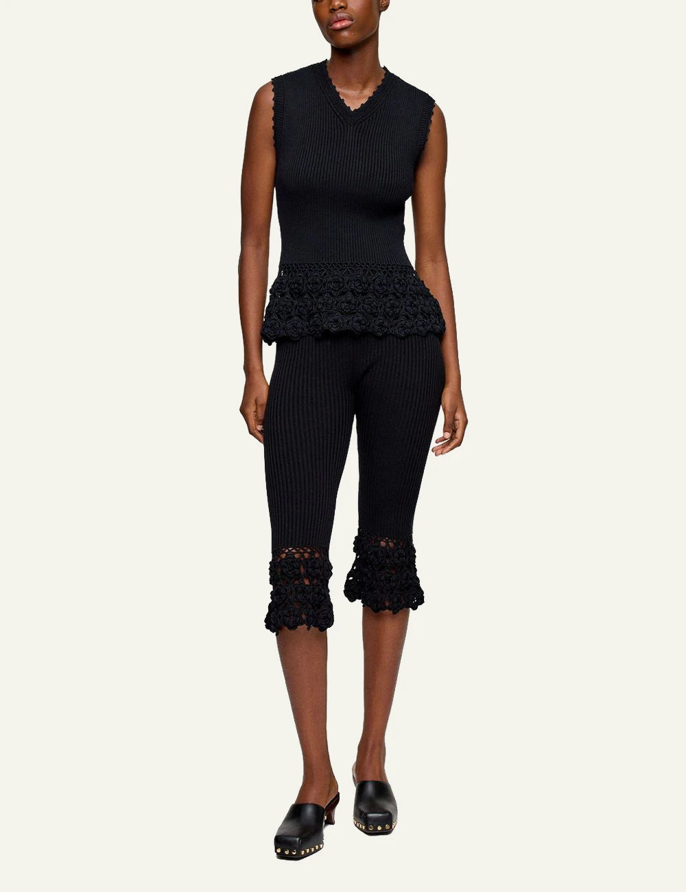 Ganni rib crochet pants black flared knit hem detail front full body view