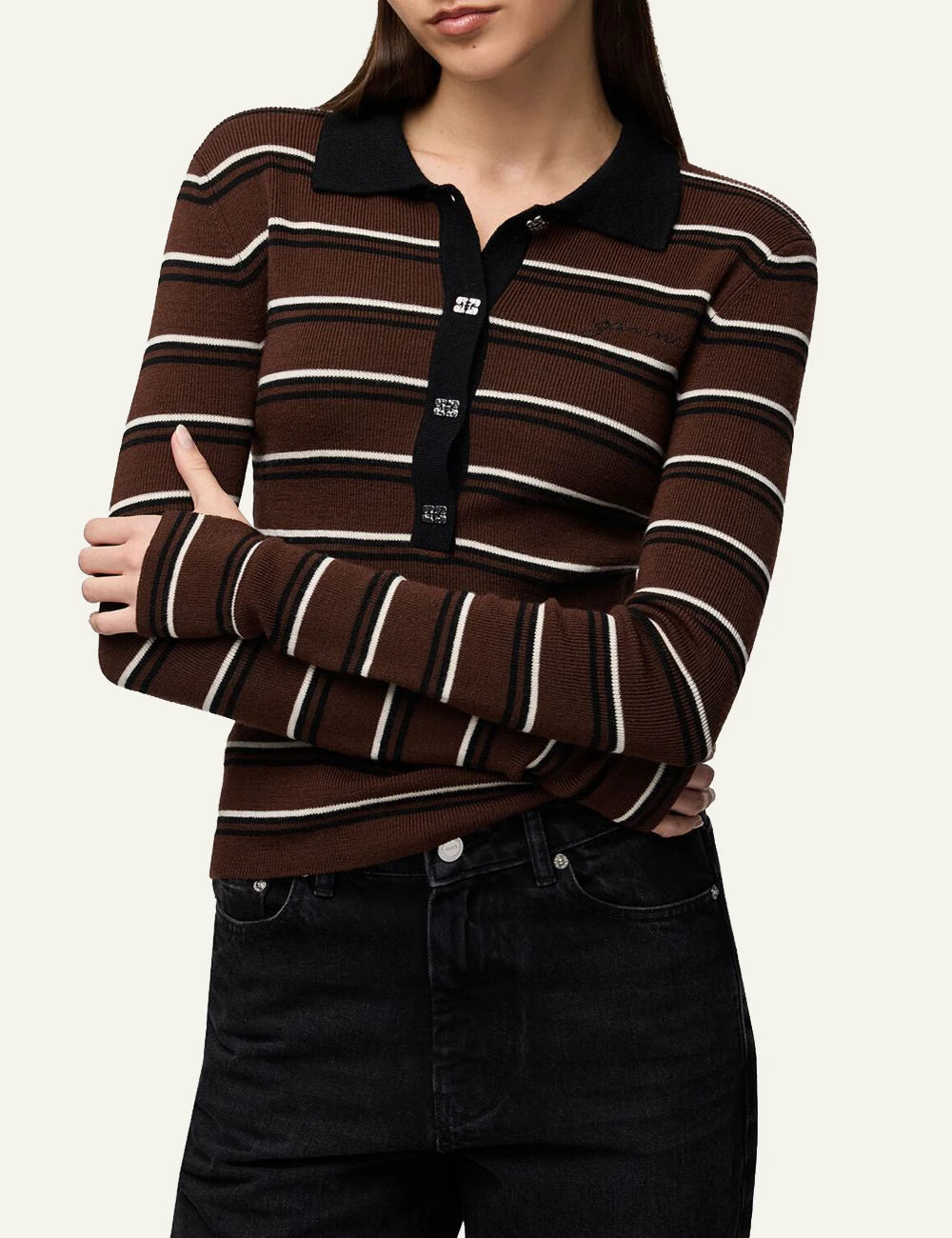 Women's GANNI brown striped wool polo top with black collar and Butterfly logo buttons model