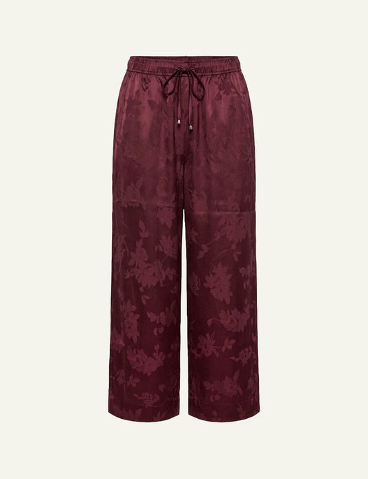 Women's Ganni burgundy satin jacquard wide leg trousers with floral pattern