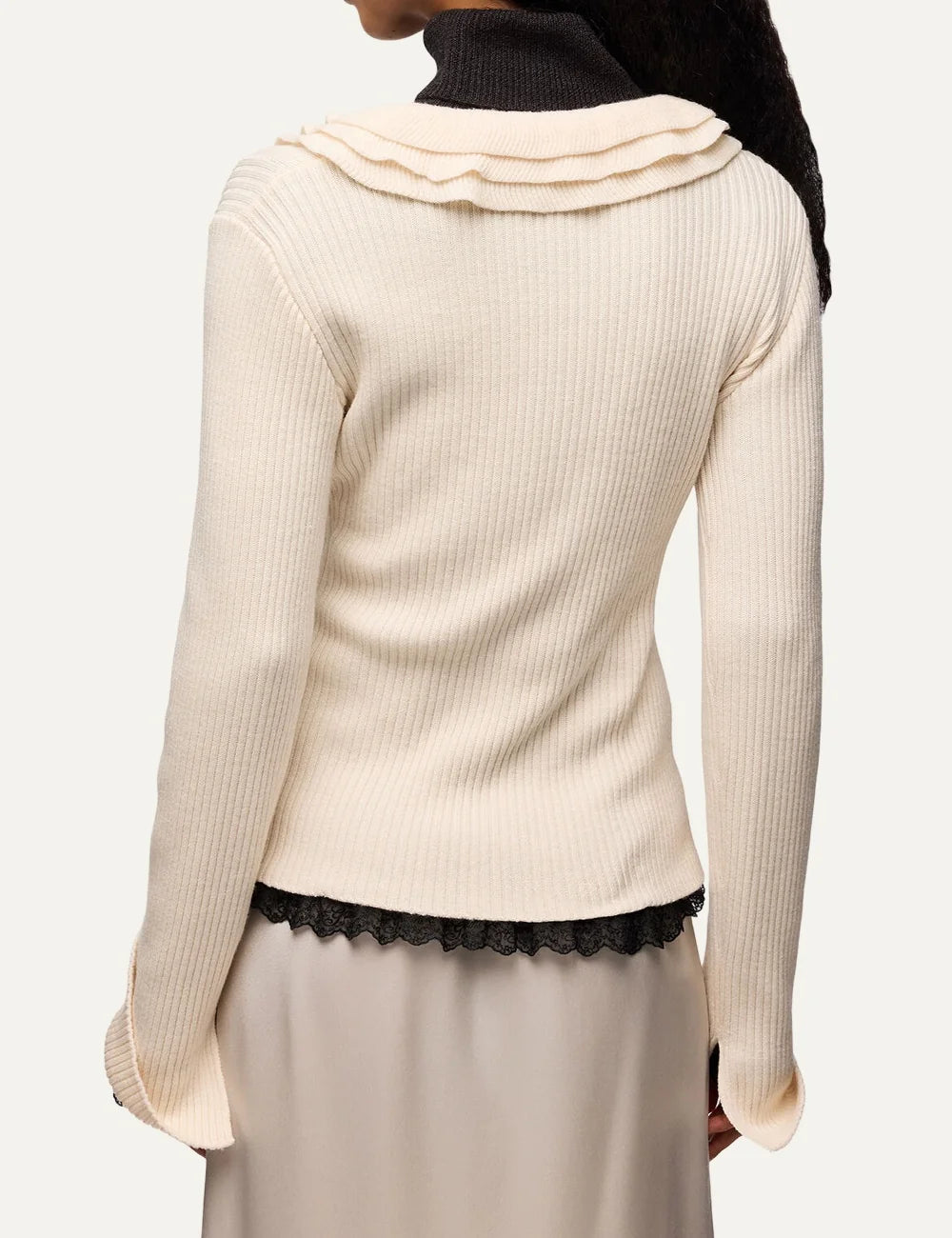 Ganni women's ecru ribbed knit top with ruffled V-neckline, long sleeves and Butterfly logo back