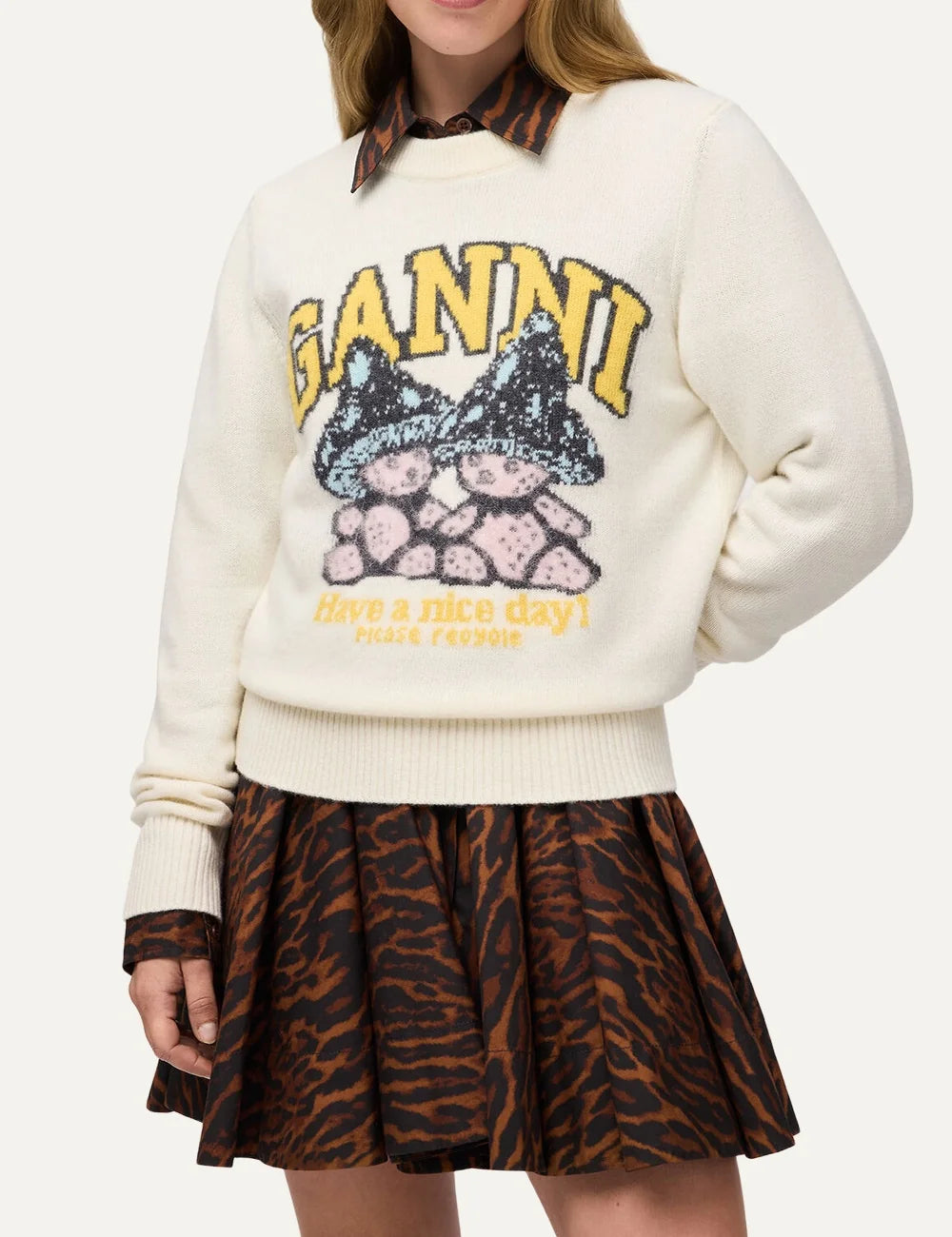 Ganni women's ecru wool blend sweater with mushroom teddy graphic, yellow logo, crew neck and ribbed trims model