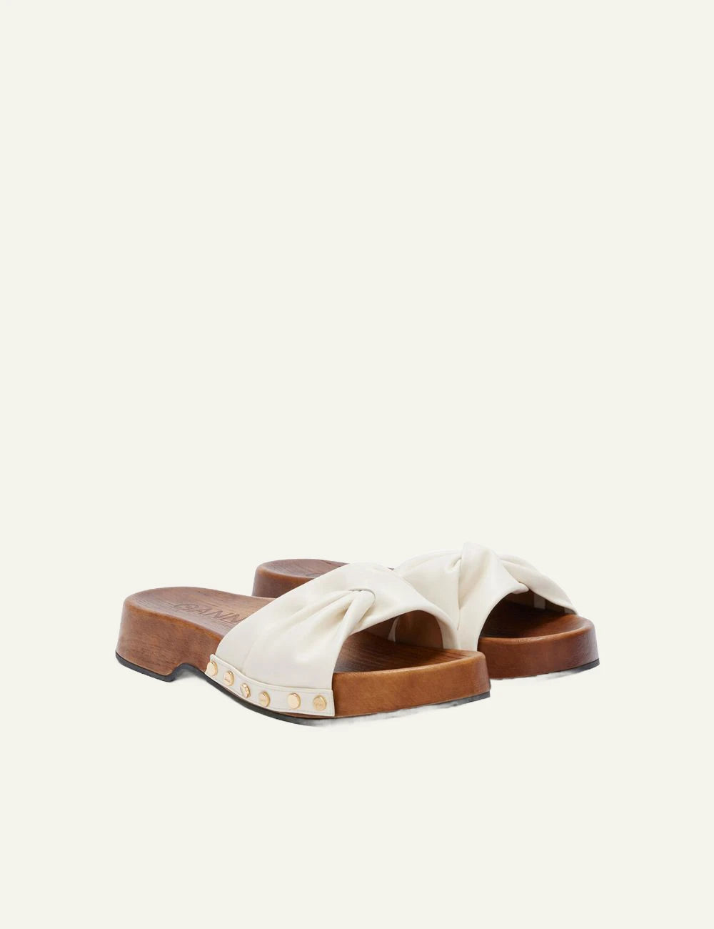 Ganni wooden clogs off white leather strap with stud details profile view