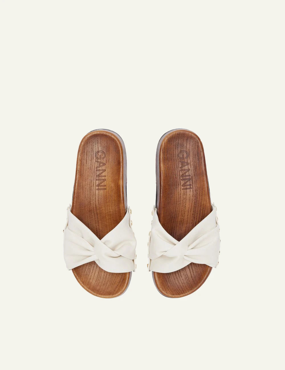 Ganni wooden clogs off white leather strap with stud details top view