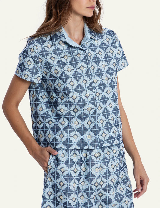 Greek Archaic Kori blue floral patterned shirt front view