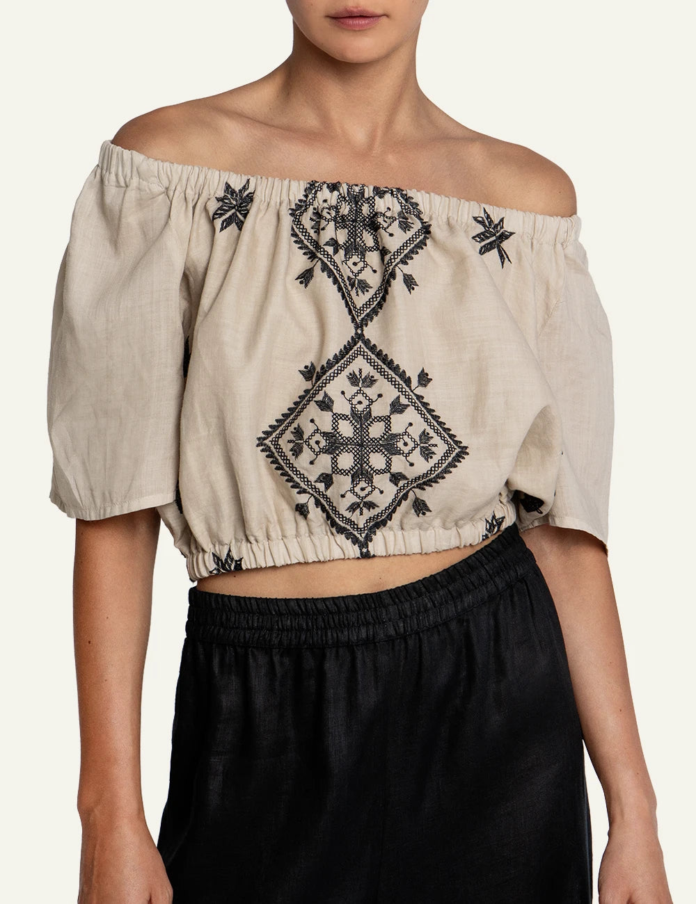 Greek Archaic Kori Lefkada embroidered linen off shoulder top front view