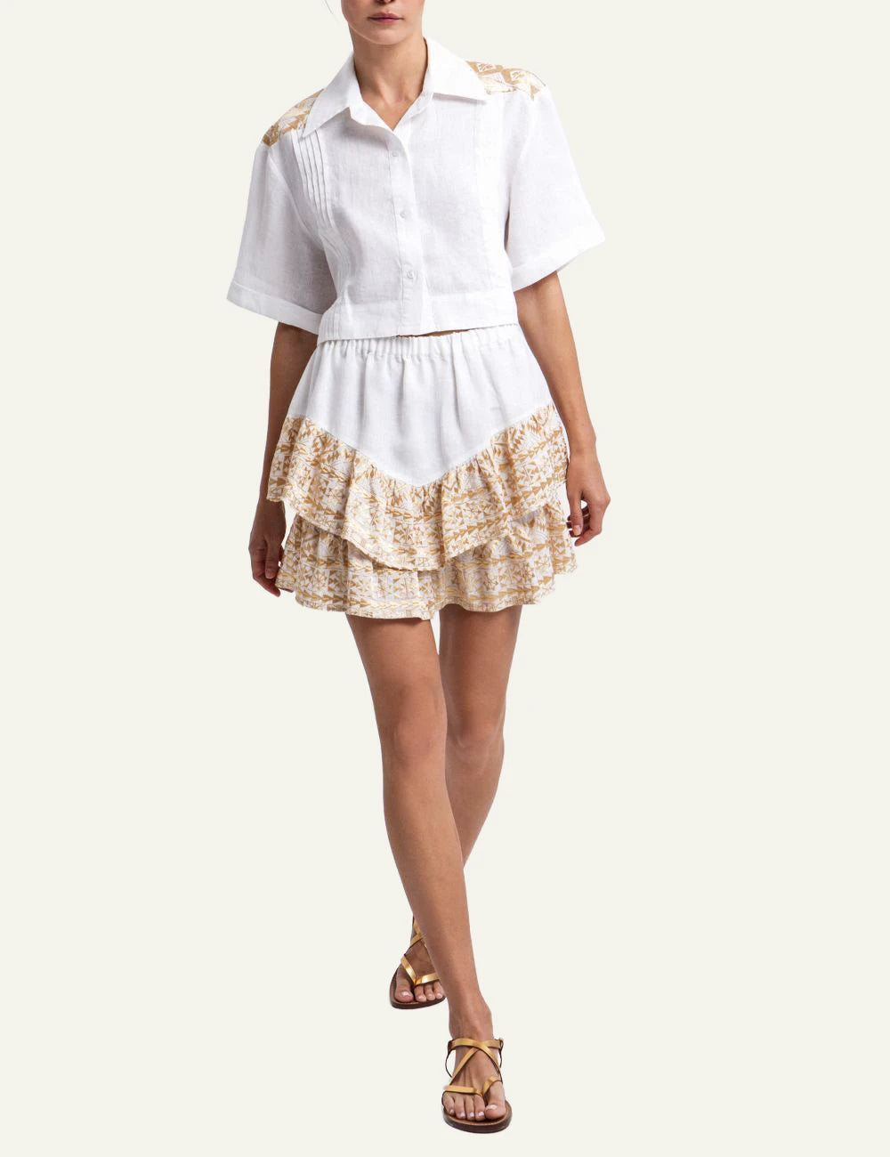 Greek Archaic Kori mini skirt white gold embroidered ruffle front full body