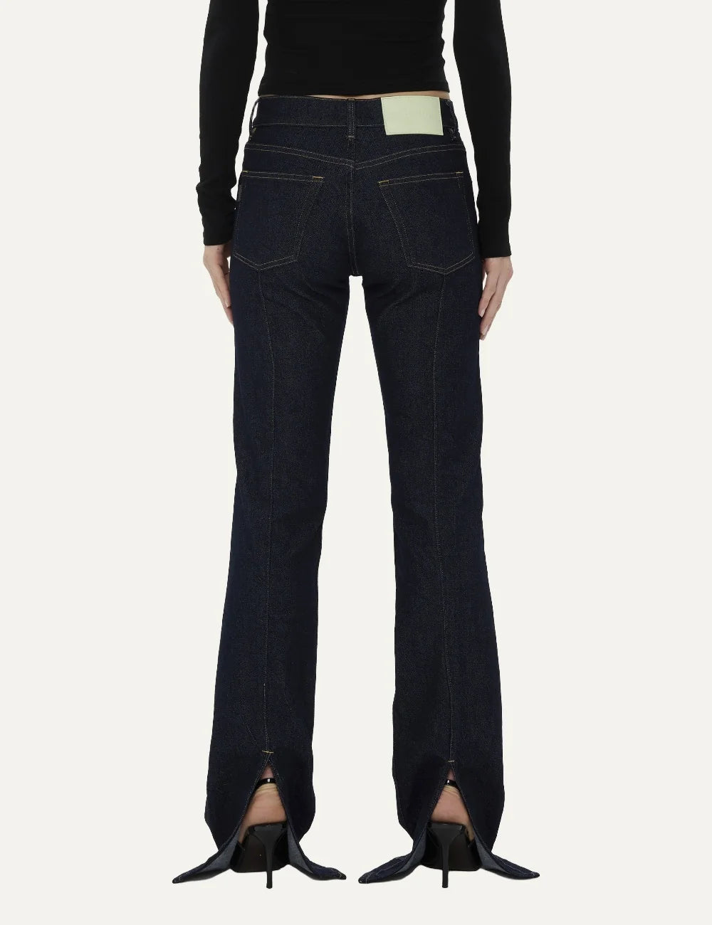 Haikure women Chewy Normal Wash dark blue flared jeans with five-pocket design and back hem slits back view