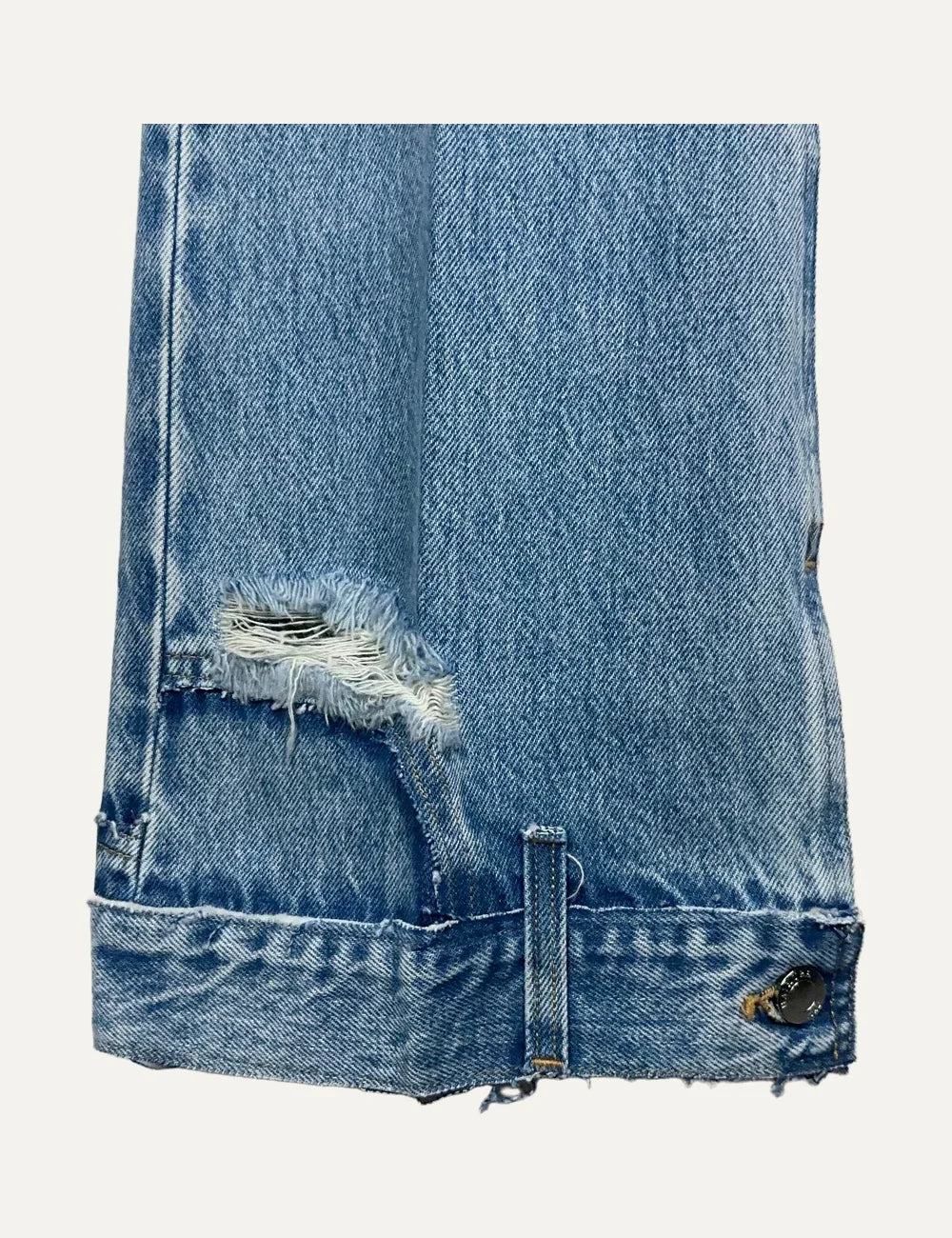 Haikure women blue washed flared jeans with distressed detail and buttoned hem straps close up details