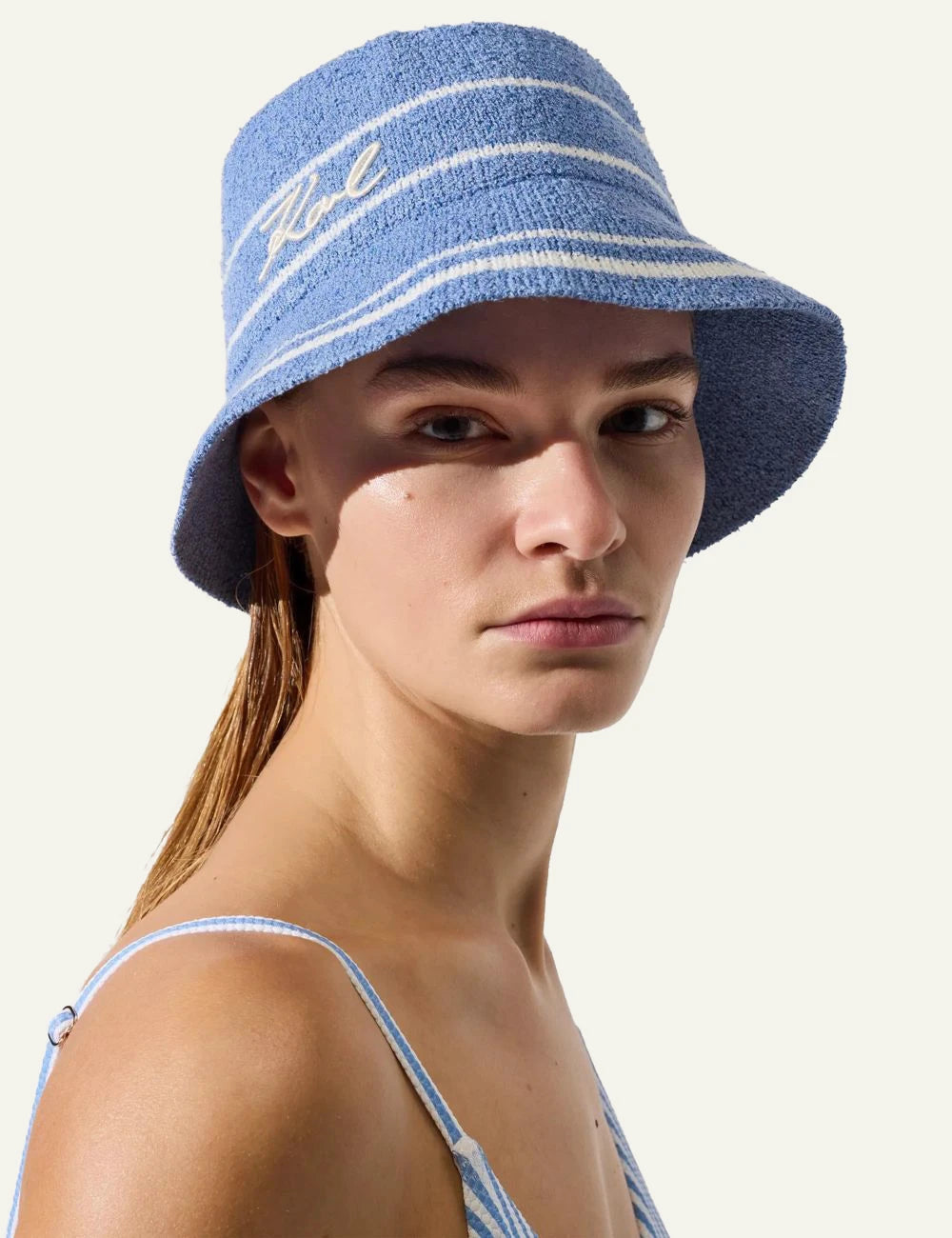 Karl Lagerfeld bucket hat blue knit white stripes Karl logo front model view