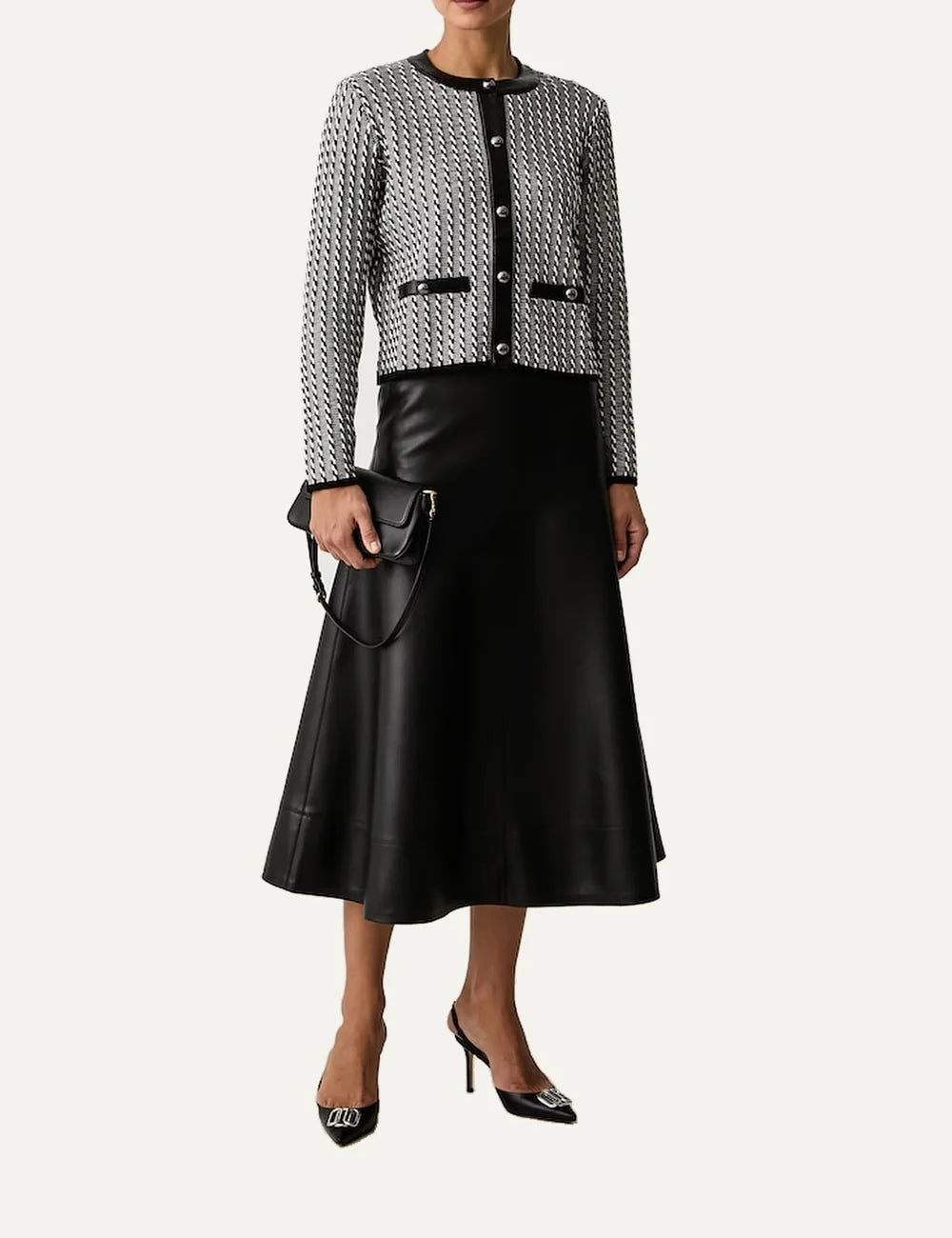 Karl Lagerfeld women's black and white cropped knitted cardigan with geometric stripe pattern, round neckline, metallic buttons and black trim.