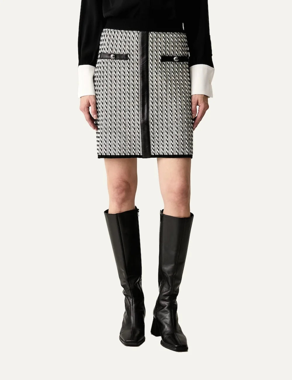 Karl Lagerfeld women's black and white knitted mini skirt with geometric pattern, straight fit and black faux leather trim.