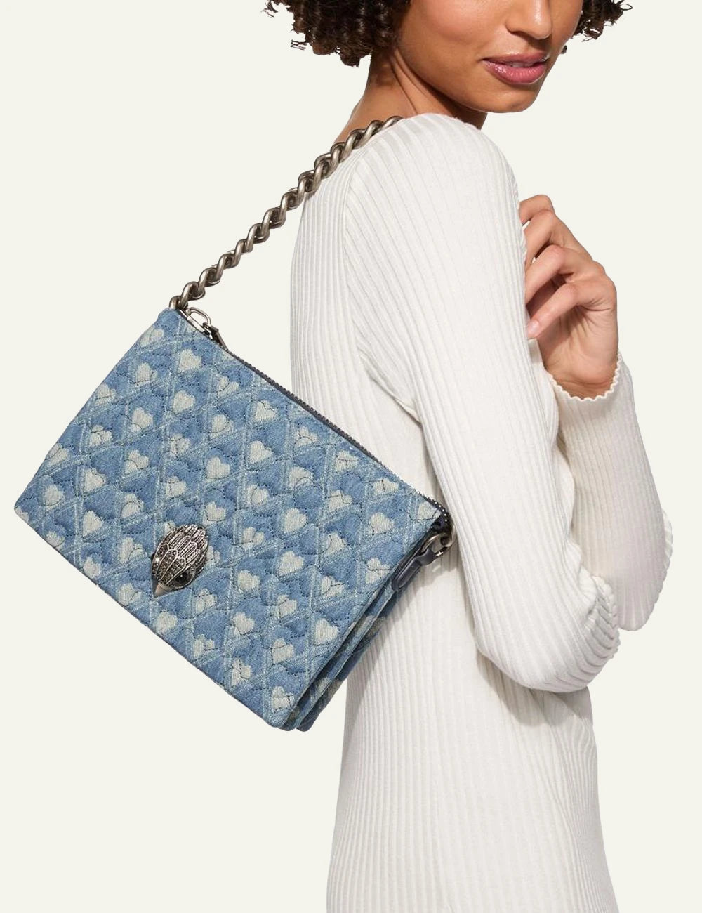 Kurt Geiger Kensington Puff denim bag worn on shoulder on model