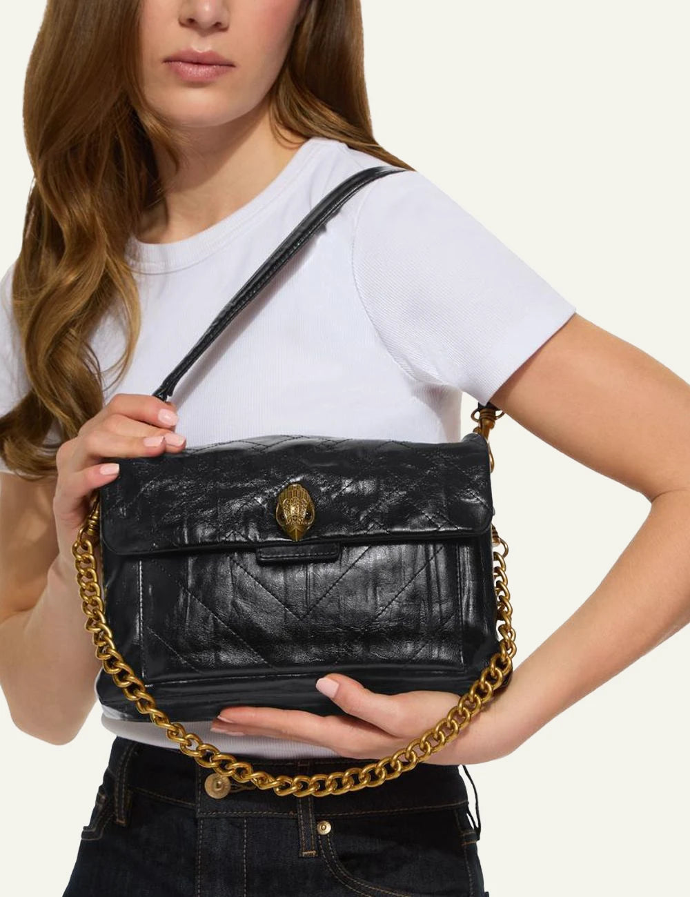 Black crinkled leather Kurt Geiger shoulder bag with quilted finish, gold chain strap and eagle head clasp model