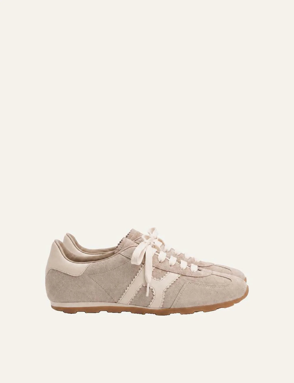 Komis &amp; Komis women's Ardesia beige suede sneakers with cream leather side stripes, lace-up closure and brown rubber sole.