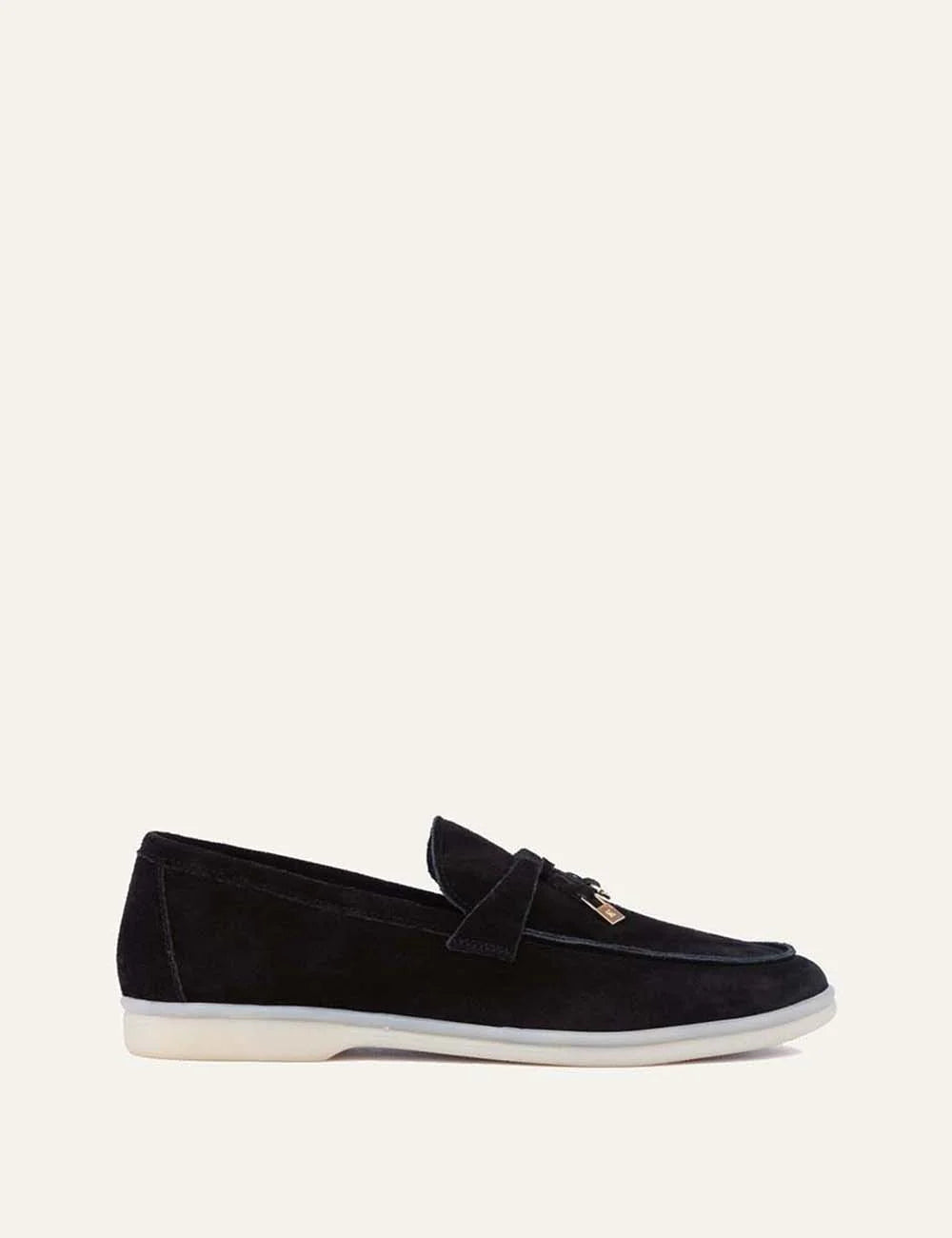 Komis &amp; Komis men's black suede loafers with gold-tone metal detail and contrasting cream rubber sole, side view