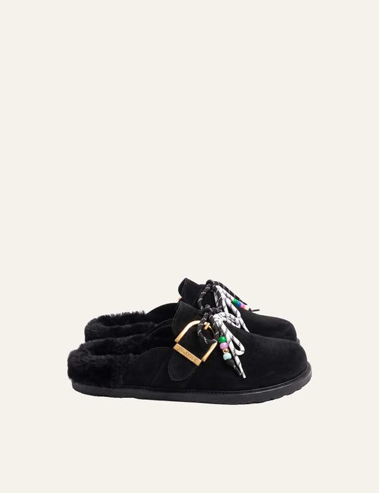 Komis &amp; Komis women's black suede fur-lined clogs with gold buckle.