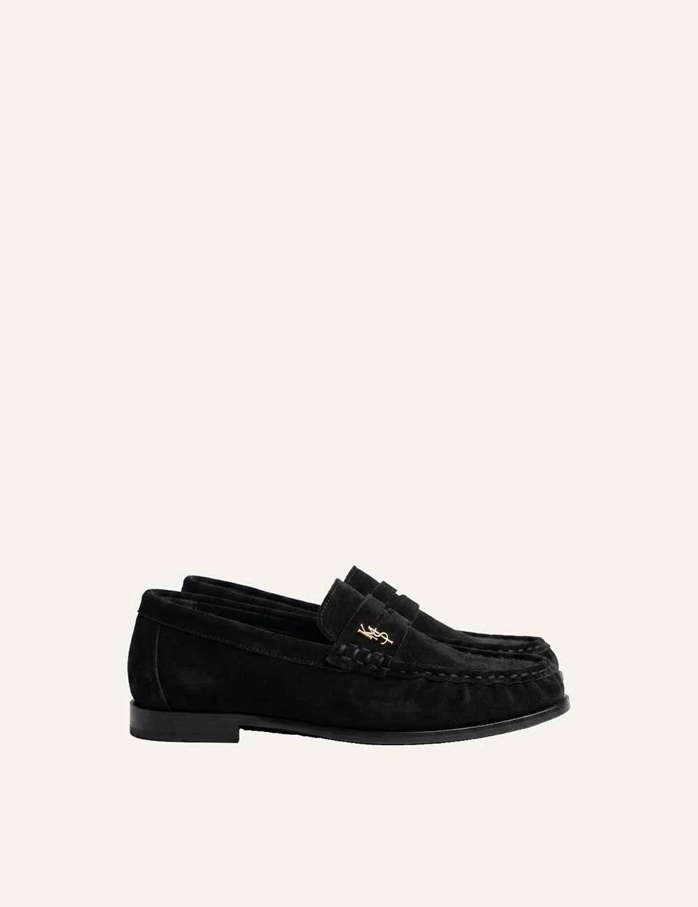 Komis &amp; Komis women's black leather loafers with gold logo and ruched toe.