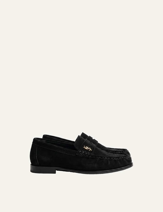 Komis &amp; Komis women's black leather loafers with gold logo and ruched toe.