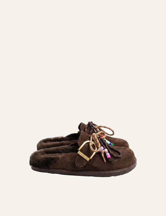 Komis &amp; Komis women's brown suede fur-lined mules with gold buckle.
